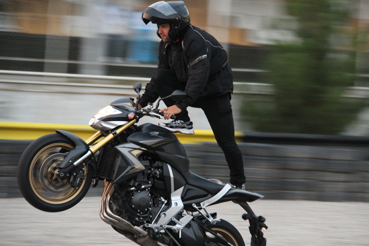 Motorcyclist in helmet riding on a city road